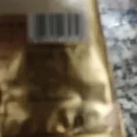 A blurry photograph where the nutrition text is unreadable.
